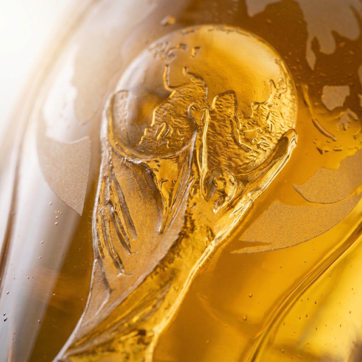 Macro of the hand-etched trophy and globe detail
